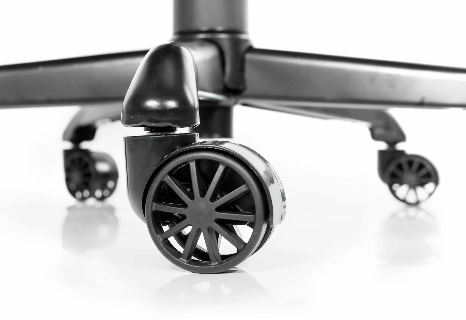 The sturdy wheelbase and casters of the Aether Pro.