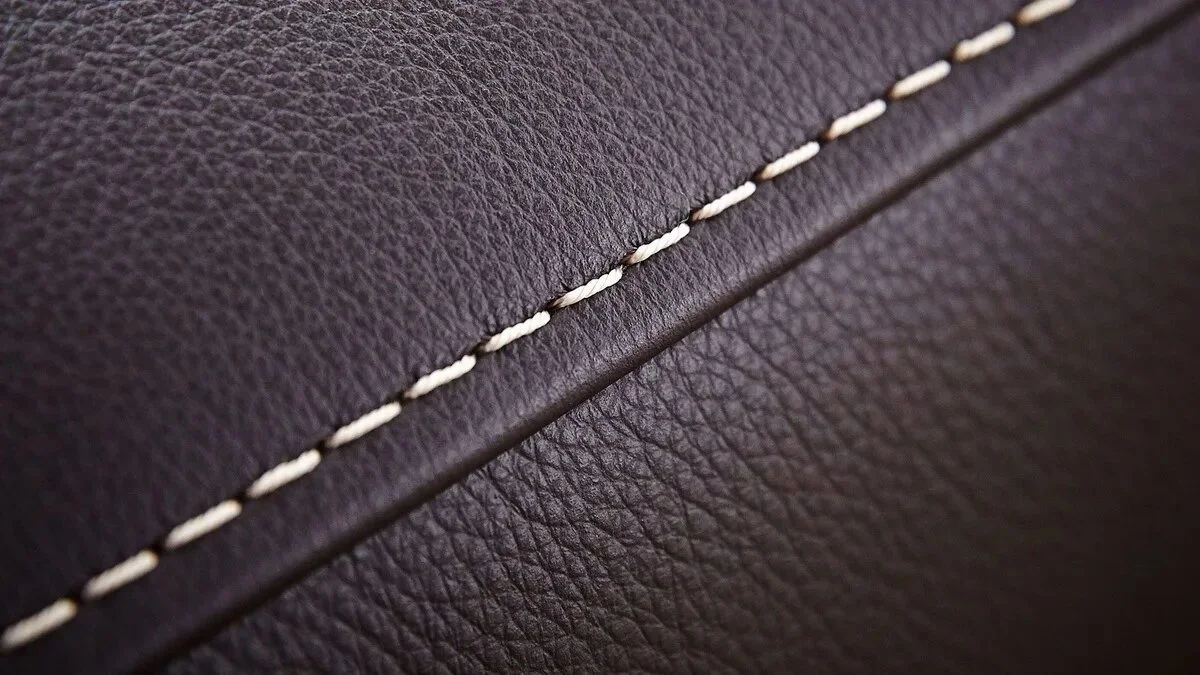 A close-up view of the precise stitching on the matte leatherette.